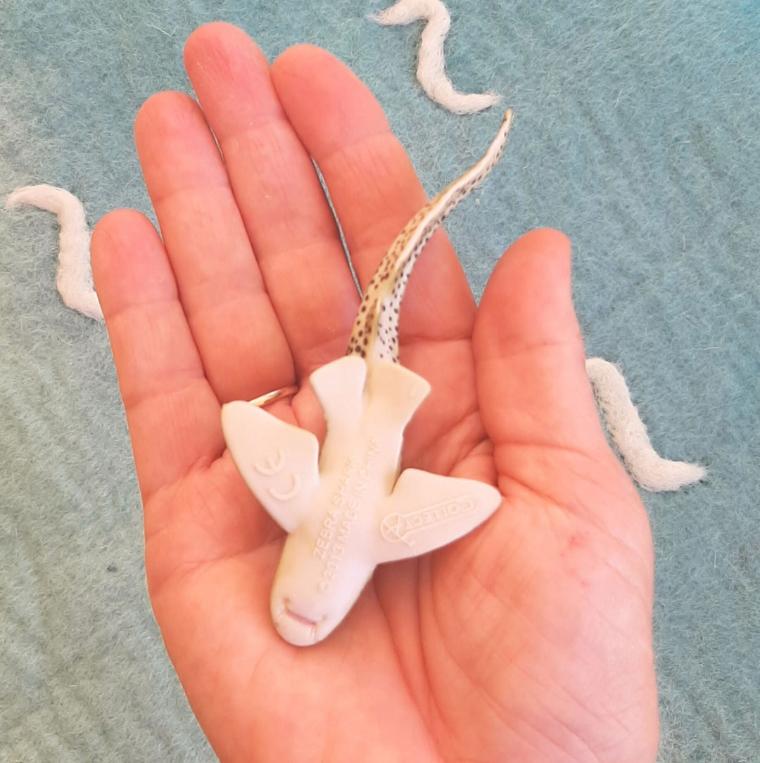 underside of zebra shark toy figurine